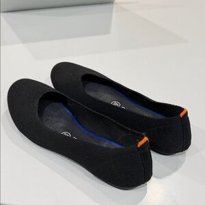 Rothy’s Black Flats with Orange Accent